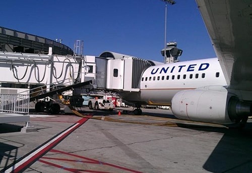United Airlines plane parked at the airport gate.