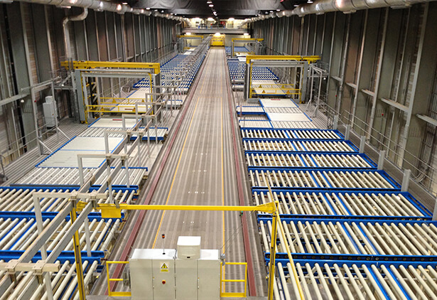 Expansive cargo facility with conveyor belts, shelves, and storage racks for efficient goods management.